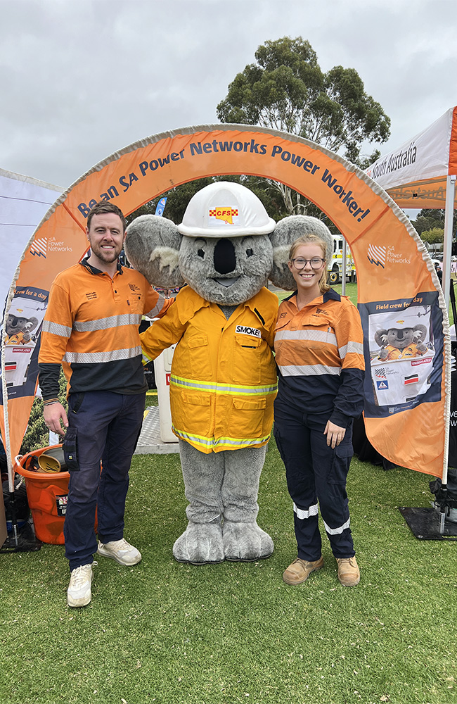 Our crew pose for a photo with Smokey from the CFS